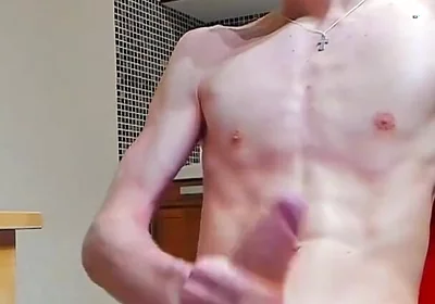A young beautiful gay twink fucks a vibrator