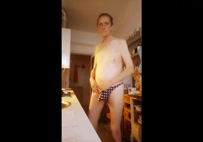 nude in kitchen with hammer in ass