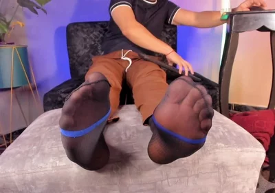 College Teacher Relaxes on the Couch at Home with His Feet on the Furniture so He Can Adore Them