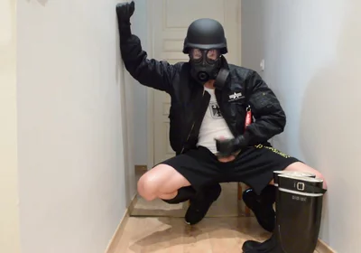 Gas masked guy cums on his rubber boots