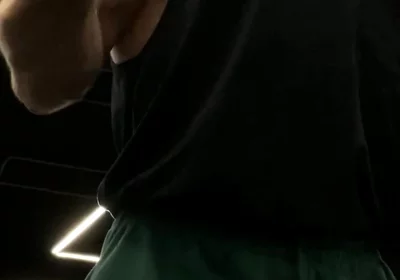 Doing a Biceps Curls with a Straight Barbell