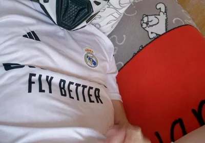 The Guy Is Wearing a Soccer Uniform and Mxhelmet with a Morning Cum