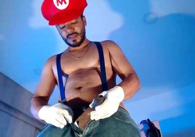 Dressed as Mario Bros Playing with His Plumbing Tool
