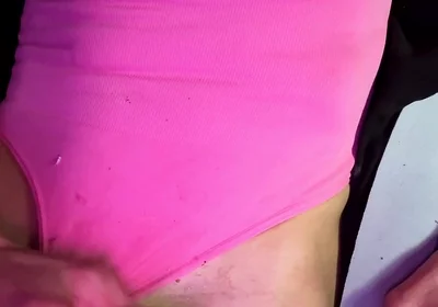 Crossdresser Michelle Wearing Pink Bodysuit While Playing with Cock