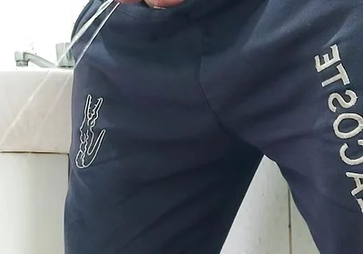 A Well-endowed Brazilian Man Urinating and Showing His Thick Penis to His Female Friends.