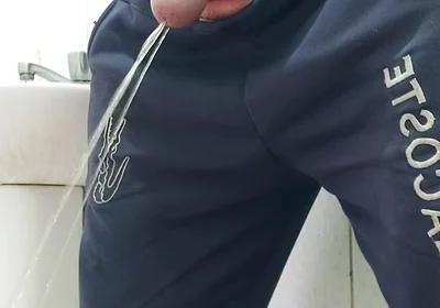 A Well-endowed Brazilian Man Urinating and Showing His Thick Penis to His Female Friends.