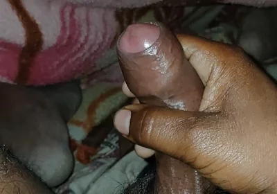 Big Boss massaging penis oil under the blanket