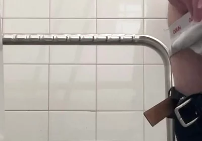 In the Hospital Toilets, a Guy Pisses Into a Cup for a Urine Sample, Then Gets Horny, Jerks-off and Cums