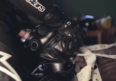 Rubber boy sucking biker master cock
