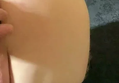 A Crossdresser in Leggings and a Seductive Bodysuit Plays with Ass