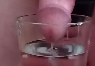 Cumming in a glass of hot water