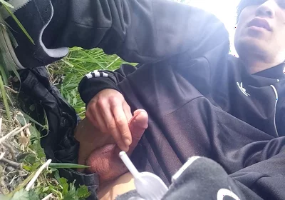 Gay boy Jon Arteen, wearing adidas tracksuit Campus sneakers, gets a hard-on outdoors