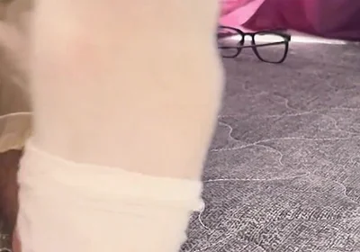 A University Rests Her Feet on Her Face so That the Adorers