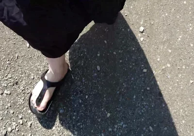 Outdoor in a Black Caftan and Barefoot in Black Birkenstocks