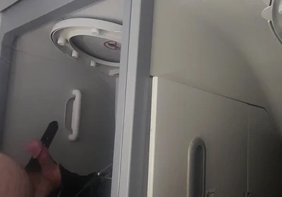 Airplane Bathroom Jerk and Cum.