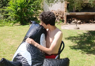 Beautiful Man Inflates His Inflatable Whale Near Pool Outside