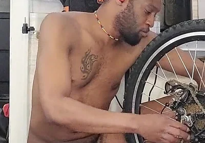 Kennie Jai Does a Nude Bike Repair. Watch That Big Dick Swing!