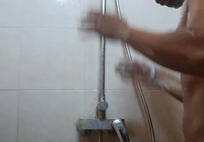 Exotic Skinned Asian Adult Man Taking a Shower in the Morning